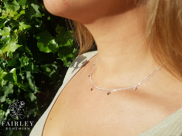 layering necklace on model
